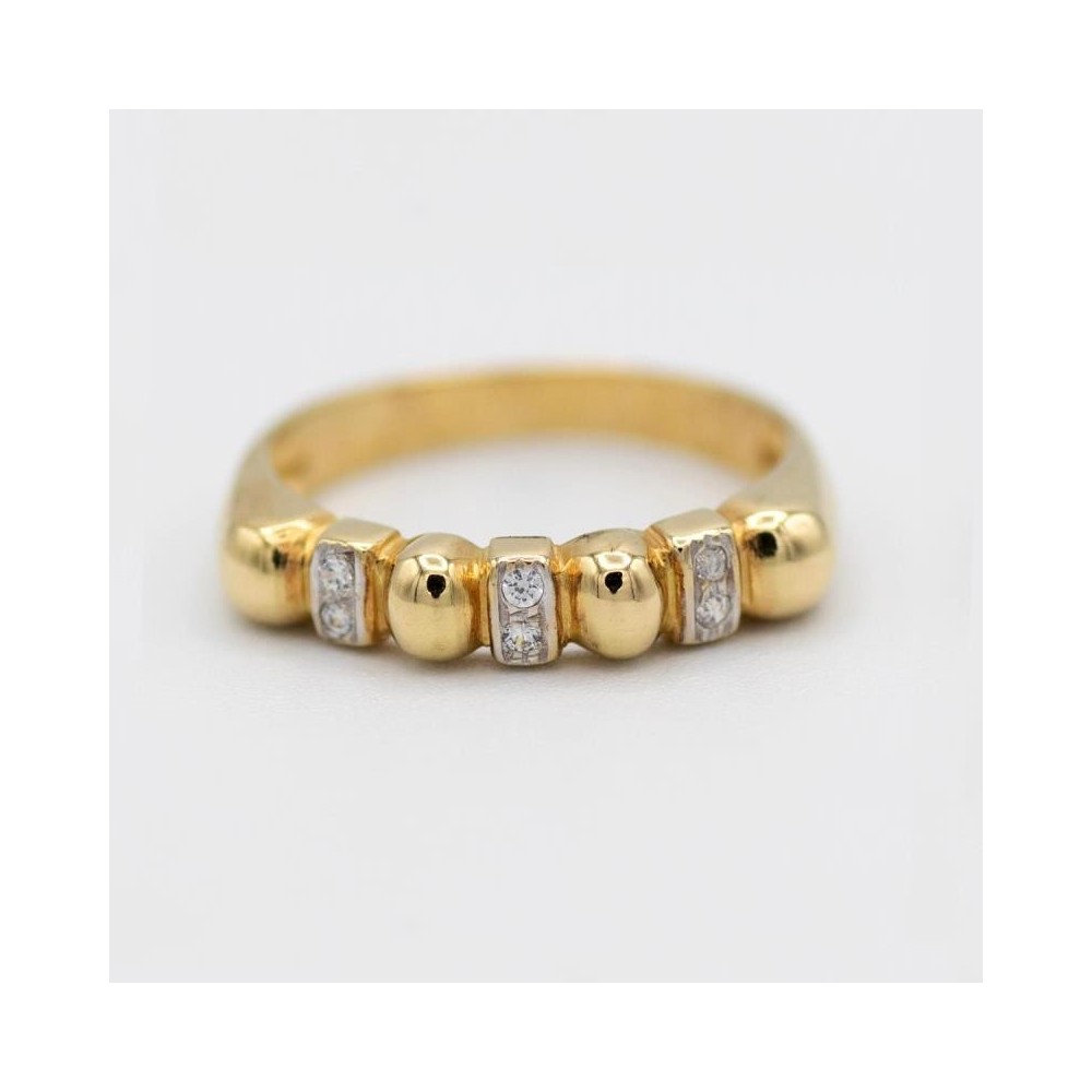 107338 - Anillo de oro 18 kilates con 6 circonitas